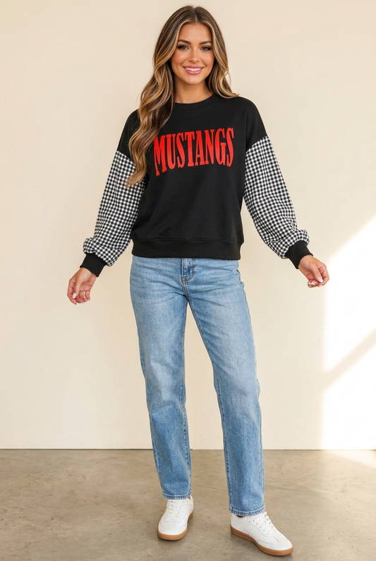 Full-body view of black MUSTANGS sweatshirt with gingham sleeves, styled with light-wash jeans and white sneakers.